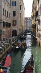 Gondola floating through a Venice canal 
